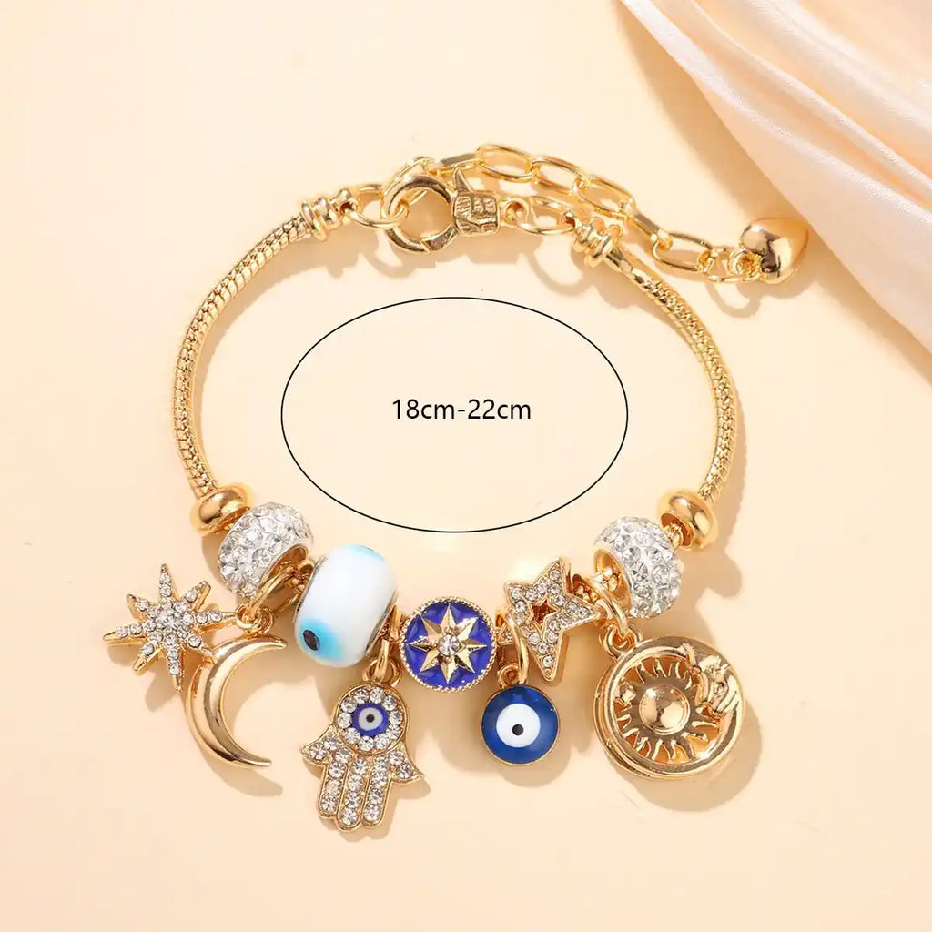 Bracelet Céleste Porte-Bonheur & Protection – Main de Fatma, Œil Protecteur & Soleil Doré (Paiement à la Livraison)